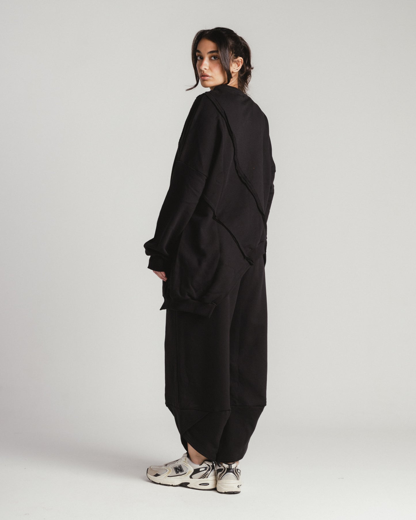 Asymmetrical sweatshirt and jogger set in black