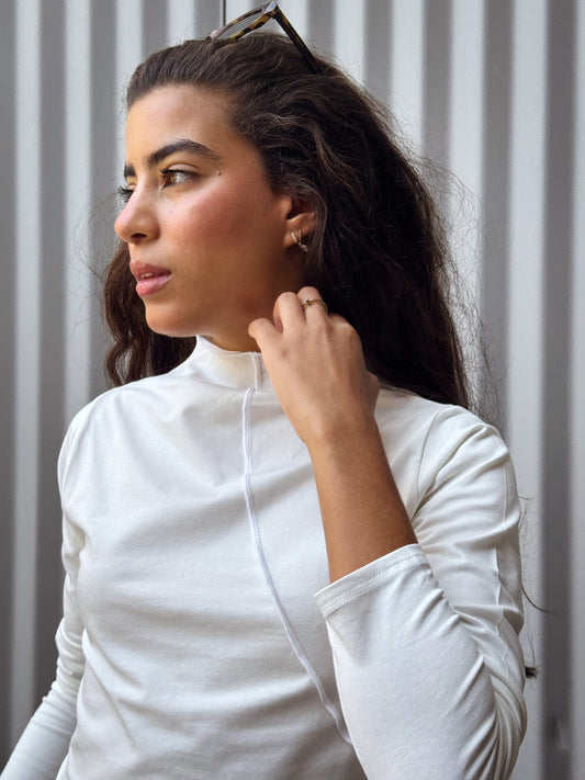 Tight long sleeve top in off white